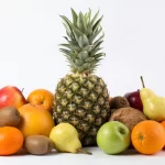 colorful-fruits-tasty-fresh-ripe-juicy-white-desk_179666-169